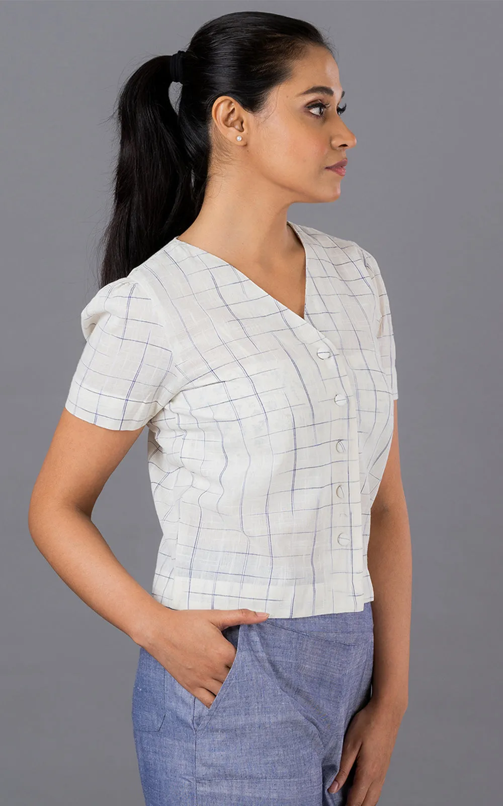 Blue disappearing check button down top