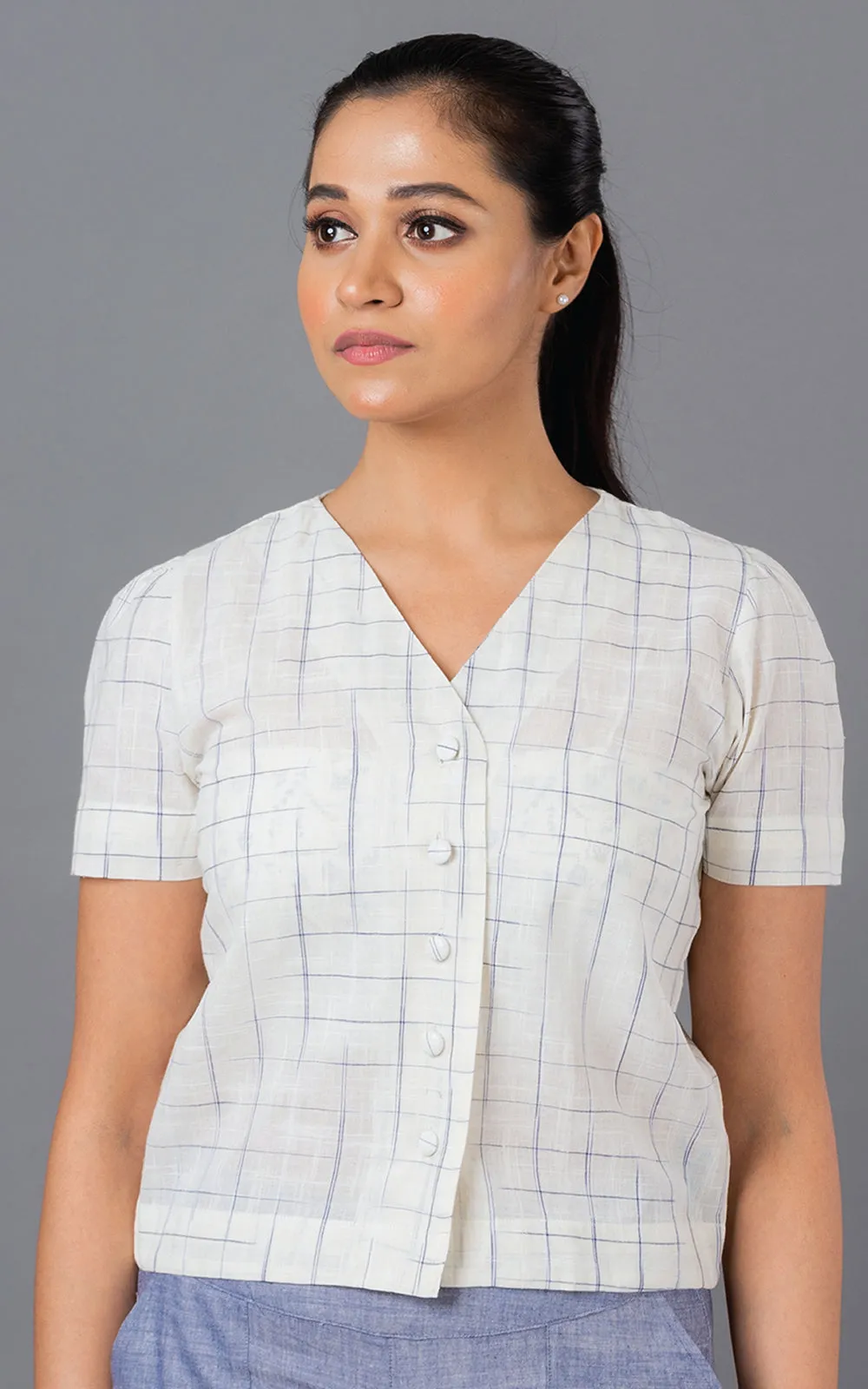 Blue disappearing check button down top