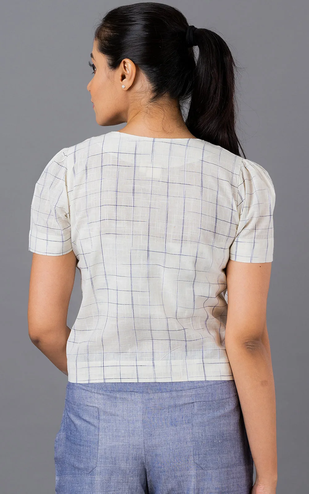 Blue disappearing check button down top